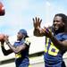 Michigan senior junior quarterback Denard Robinson and junior quarterback Devin Gardner toss the ball around during a photo opp at media day at the Al Glick Field House on Sunday afternoon. Melanie Maxwell I AnnArbor.com